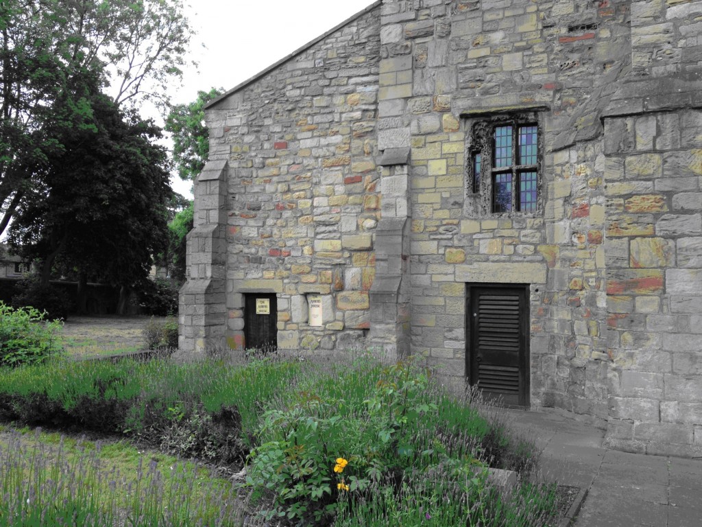 The Church of St. Mary and St. Cuthbert, Chester-le-Street, Durham: the late medieval anchorhold is pictured at the far left, sporting a door and a window; photo by Megan Hall