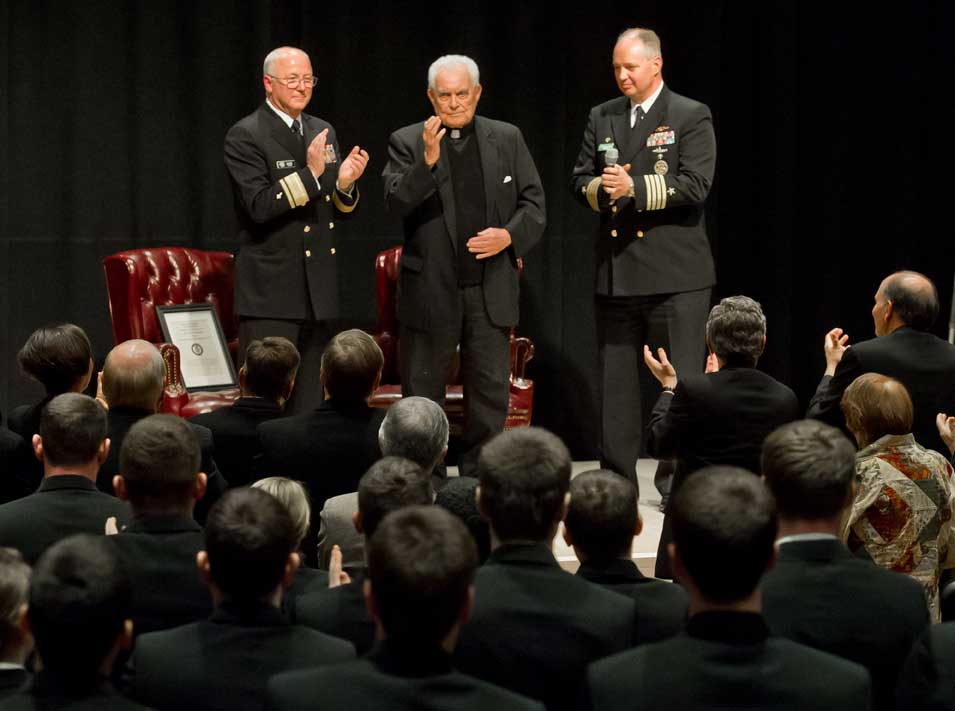 Apr. 17, 2013; President Emeritus Rev. Theodore M. Hesburgh, C.S.C. blesses the Notre Dame Naval ROTC Battalion of Midshipmen after being named an honorary Navy Chaplain by Rear Adm. Mark L. Tidd, left, Chief of Navy Chaplains and Capt. Clarence Earl Carter, Commanding Officer, Naval ROTC in the Carey Auditorium in Hesburgh Library...Photo by Matt Cashore/University of Notre Dame