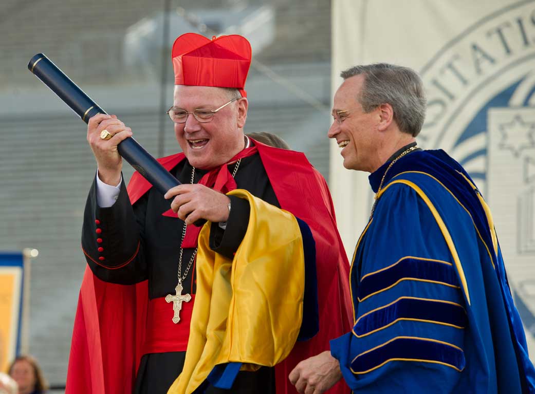 May 19, 2013; Timothy Cardinal Dolan, Archbishop of New York and Commencement speaker, reacts after receiving an honorary doctorate degree at the 2013 Commencement ceremony in Notre Dame Stadium...Photo by Matt Cashore/University of Notre Dame