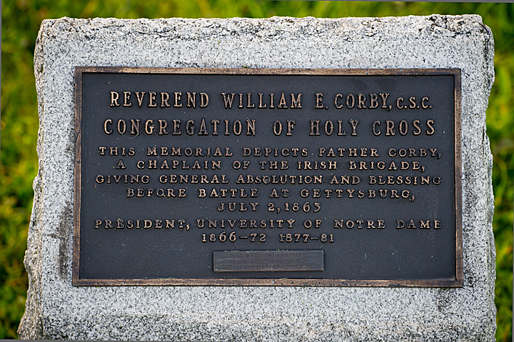 Plaque at the foot of the statue.