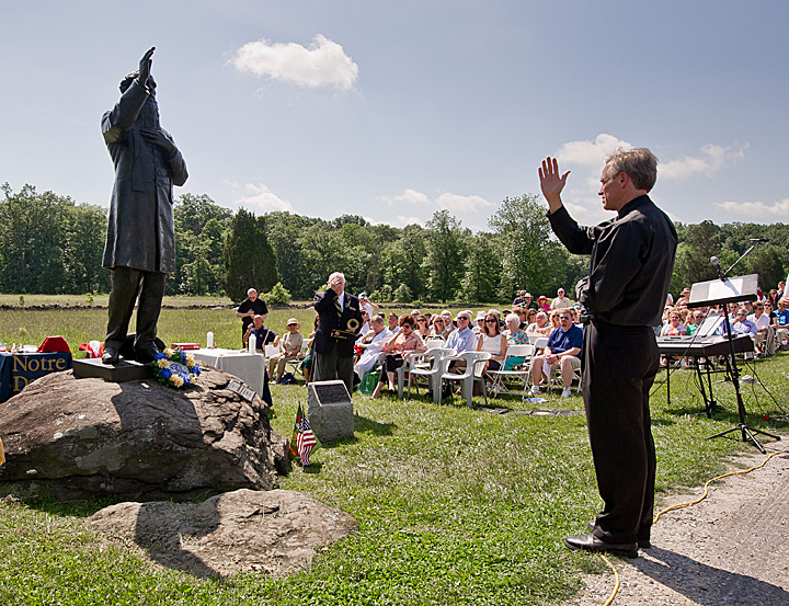 Fr. Jenkins blesses the statue.