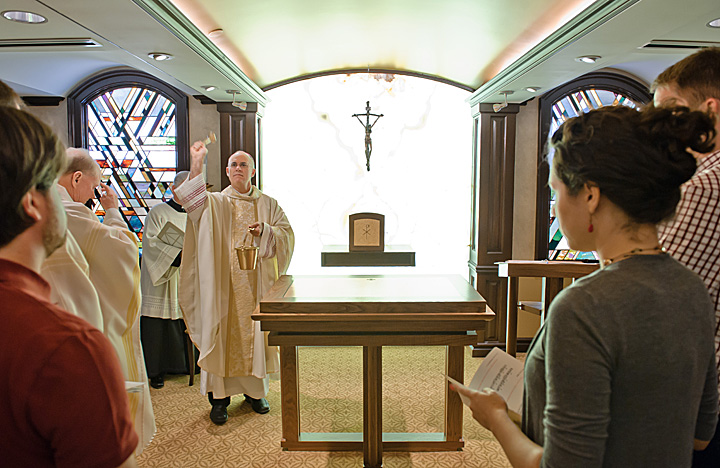 Bishop Rhoades sprinkles holy water throughout the chapel. 
