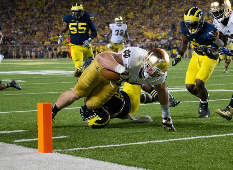 Irish tight end Troy Niklas (85) dives into the end zone for a touchdown as Michigan Wolverines safety Jarrod Wilson (22) defends in the third quarter. Photo by Matt Cashore