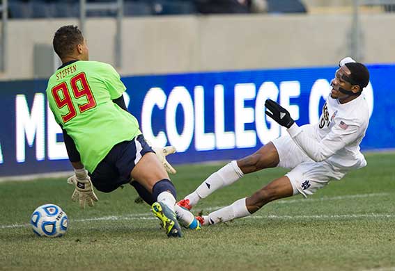 Dec. 15, 2013; Notre Dame forward Leon Brown scores against Maryland goalkeeper Zack Steffen in the first half of College Cup finals at PPL Park in Chester, Pa. Photo by Barbara Johnston/University of Notre Dame