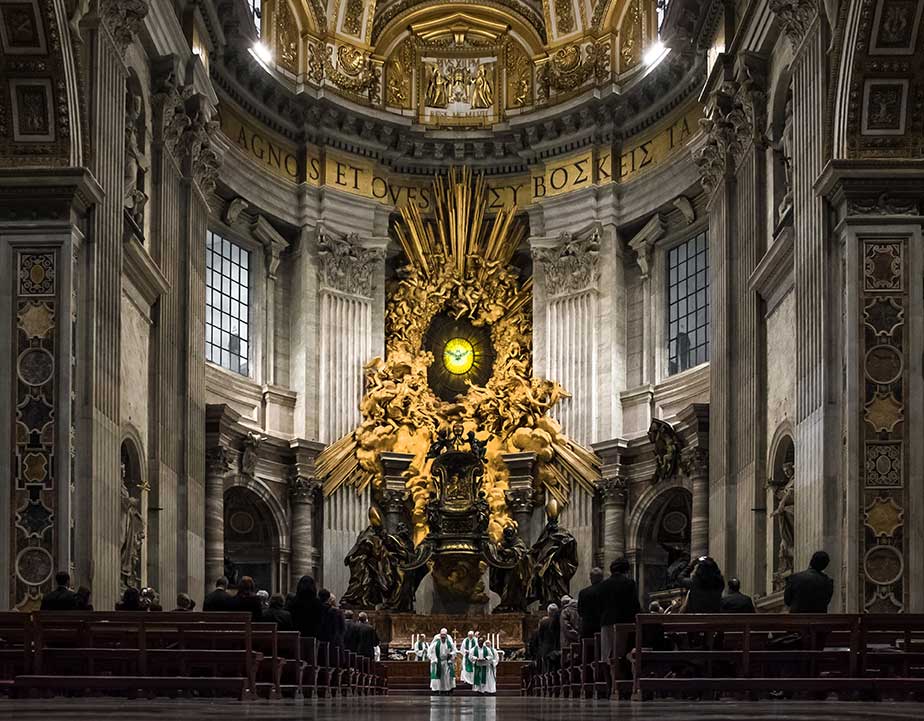 St. Peter's Basilica is, in a word: Massive.  This image of Notre Dame's C.S.C. priests concelebrating Mass at the Altar of the Chair of St. Peter conveys the scale of the place.
