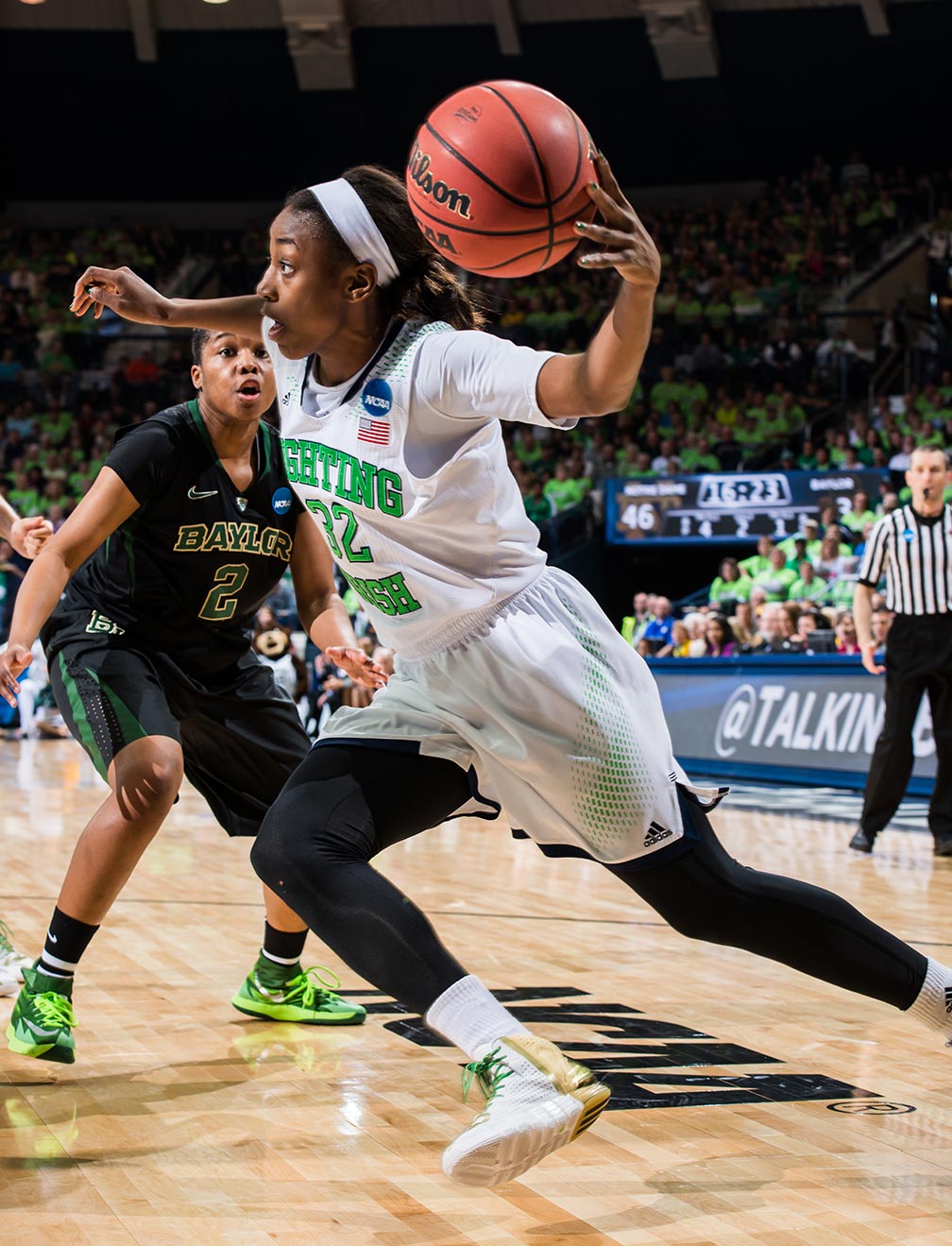 Mar 31, 2014; Jewel Loyd (32) drives to the basket as Baylor Bears guard Niya Johnson (2) defends in the regional final of the 2014 NCAA Tournament. Notre Dame won 88-69. Photo by Matt Cashore 