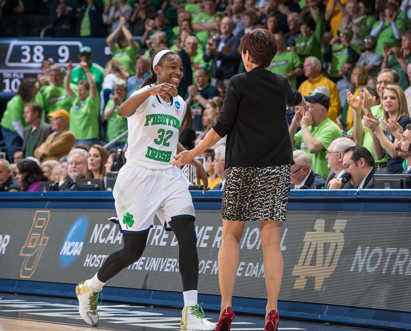 Mar 31, 2014; Jewel Loyd (32) hugs head coach Muffet McGraw as she leaves the game in the second half against the Baylor Bears in the regional final of the 2014 NCAA Tournament. Notre Dame won 88-69. Photo by Matt Cashore 