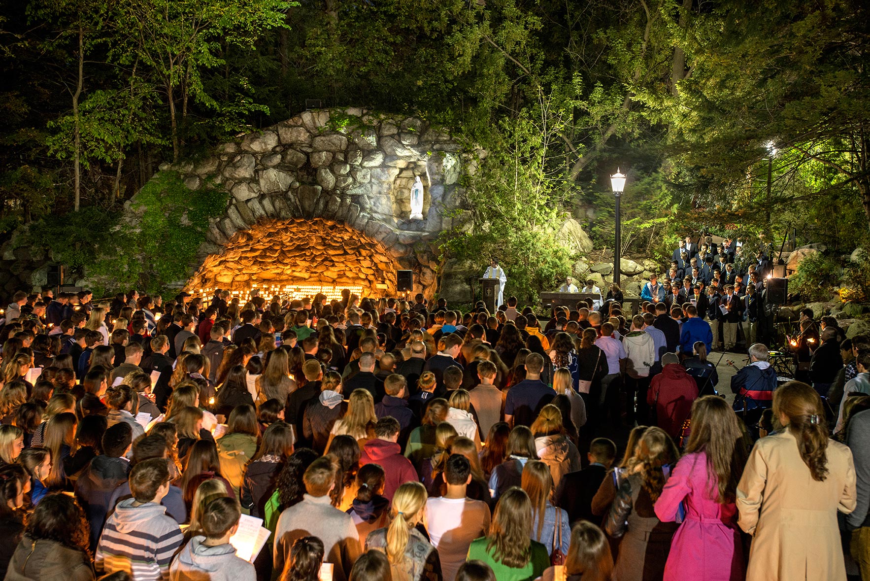 BJ - The seniors’ last visit to the Grotto is my favorite Commencement event to shoot because it is visually beautiful and the emotional element is palpable. May 15, 2014; Seniors gather at the Grotto for their last visit before the 2014 Commencement. Photo by Barbara Johnston/University of Notre Dame