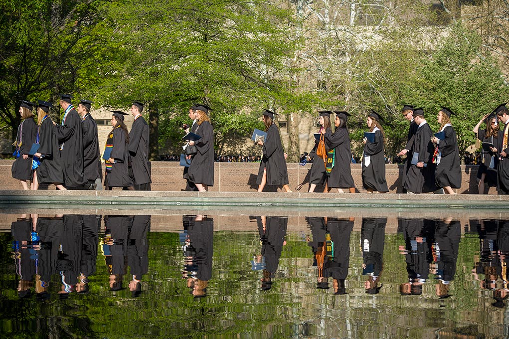 May 18, 2014; Graduates process along the reflective pond in front Hesburgh Library to Notre Dame Stadium for the 2014 Commencement ceremony. Photo by Barbara Johnston/University of Notre Dame