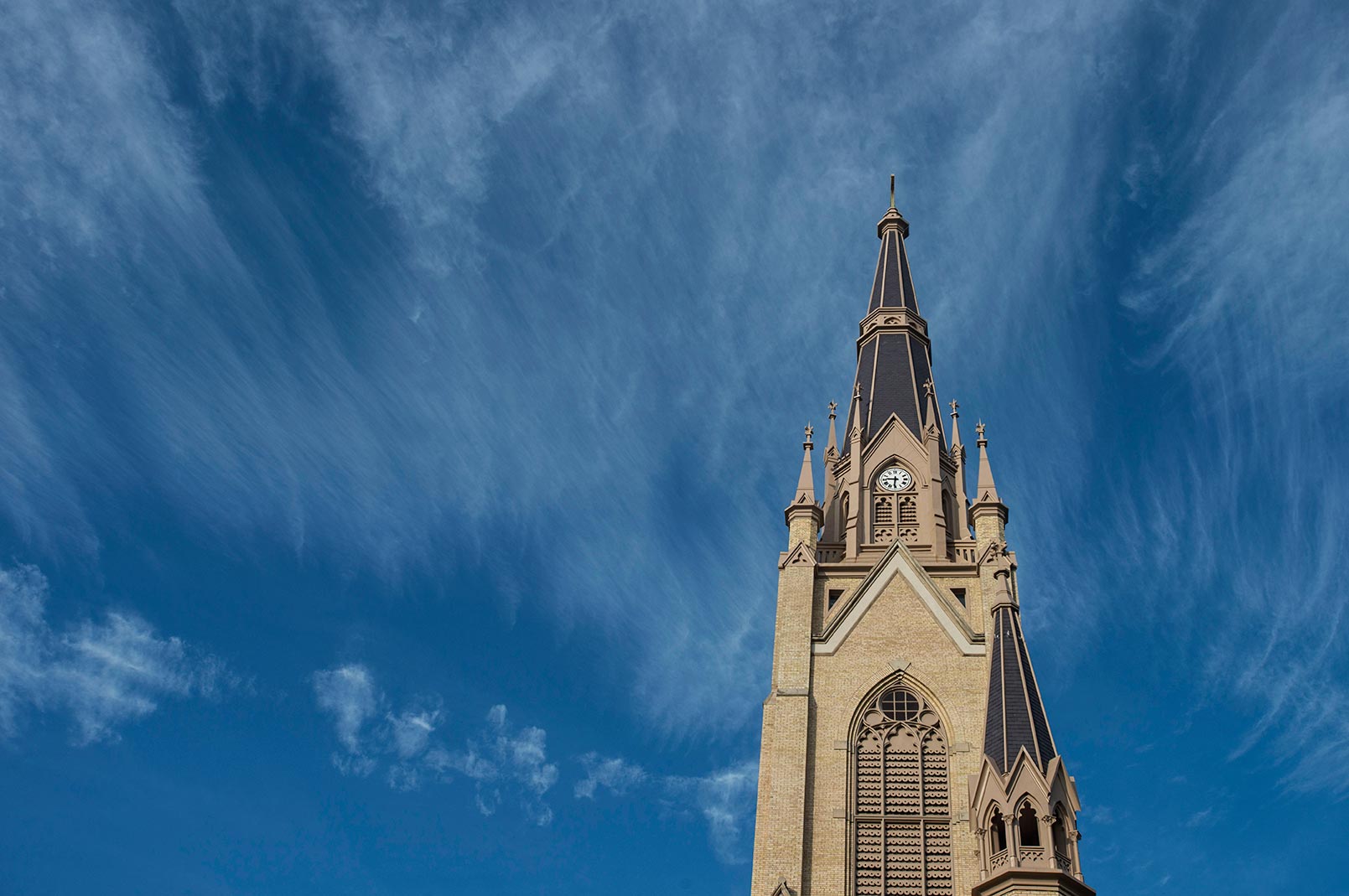 Oct. 22, 2014; Cirrus clouds form above the steeple on the Basilica of the Sacred Heart. (Photo by Barbara Johnston/University of Notre Dame)