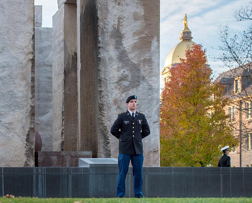 Nov. 10, 2014; ROTC cadets and midshipmen stand at attention for vigil at the Clarke Memorial Fountain in honor of Veterans Day. (Photo by Matt Cashore/University of Notre Dame)