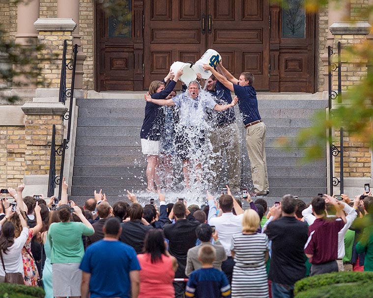 Aug. 16, 2014; Fr. John Jenkins is doused with ice water as part of the "ALS Ice Bucket Challenge." Photo by Matt Cashore/University of Notre Dame