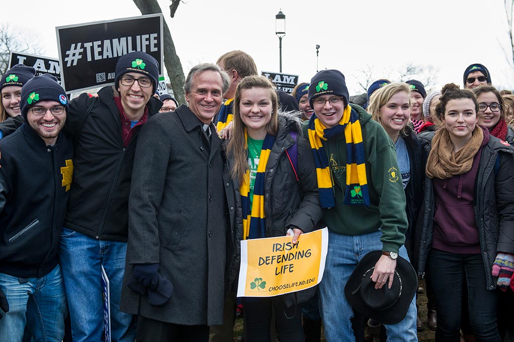 Jan. 22, 2015; University president Rev. John Jenkins C.S.C,. poses for a photo with Notre Dame students at the 2015 March for Life in Washington, D.C. Some 700 University of Notre Dame students, faculty, staff and alumni participated in the 2015 March for Life, which this year observes the 42nd anniversary of the Supreme Court’s 1973 Roe v. Wade decision legalizing abortion. (Photo by Barbara Johnston/University of Notre Dame)