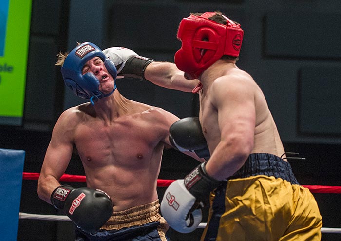 Feb. 18, 2015; Daniel Babiak connects with a hard jab to Chris Croushore (left) in the quarterfinals of the 85th Annual Bengal Bouts. (Photo by Barbara Johnston/University of Notre Dame)