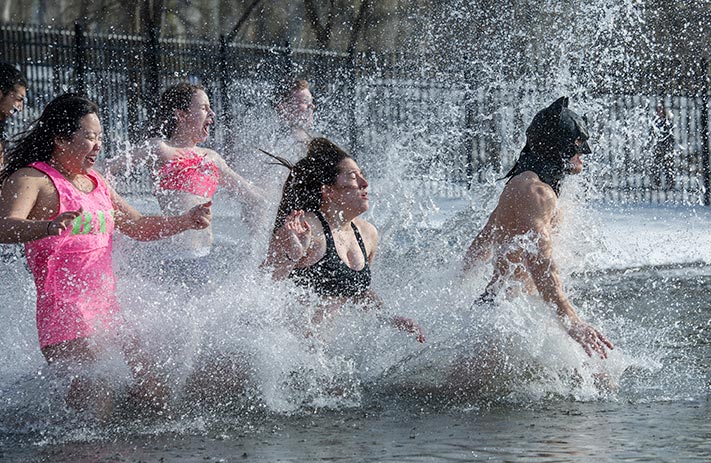 Feb. 7, 2015; Students from Dillon and Badin Halls take the annuaul Polar Bear Plunge in St. Joseph's Lake. The event allowed students to raise funds for the HOPE Initiative, a charity in Nepal that promotes education and operates an orphanage. (Photo by Barbara Johnston/University of Notre Dame)