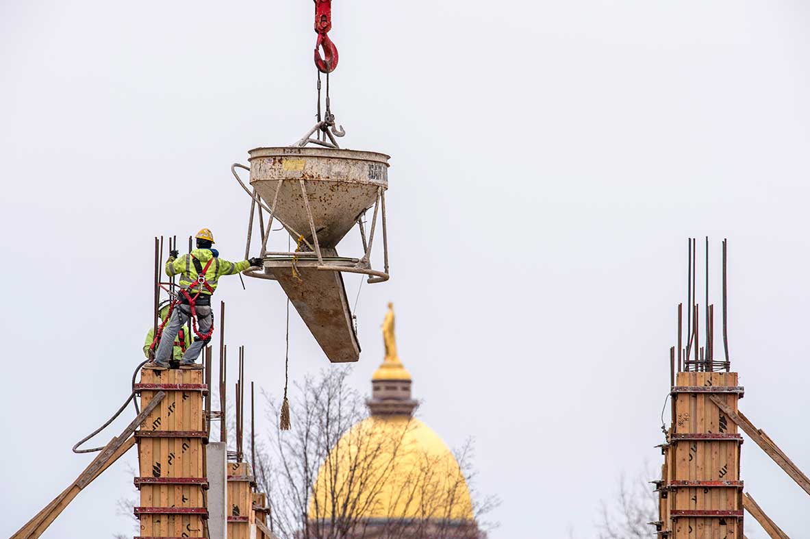 Mar. 19, 2015; Workers prepare to pour cement into a support column at McCourtney Hall construction site. (Photo by Barbara Johnston/University of Notre Dame)