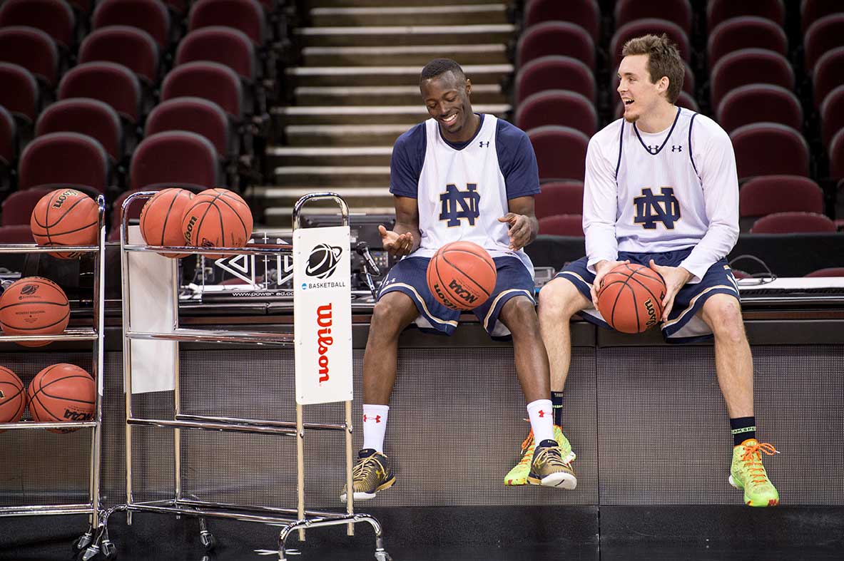 Mar. 27, 2015; Pat Connaughton (24) and Jerian Grant (22) pause during practice before the 2015 NCAA Tourament regional final against Kentucky. (Photo by Matt Cashore/University of Notre Dame)