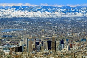 The Rocky Mountains rise up beyond the Denver skyline.